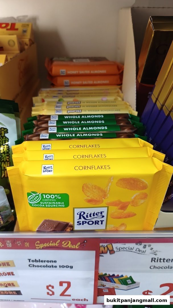 A display of various Ritter Sport chocolate bars and Toblerone, with some on special offer.