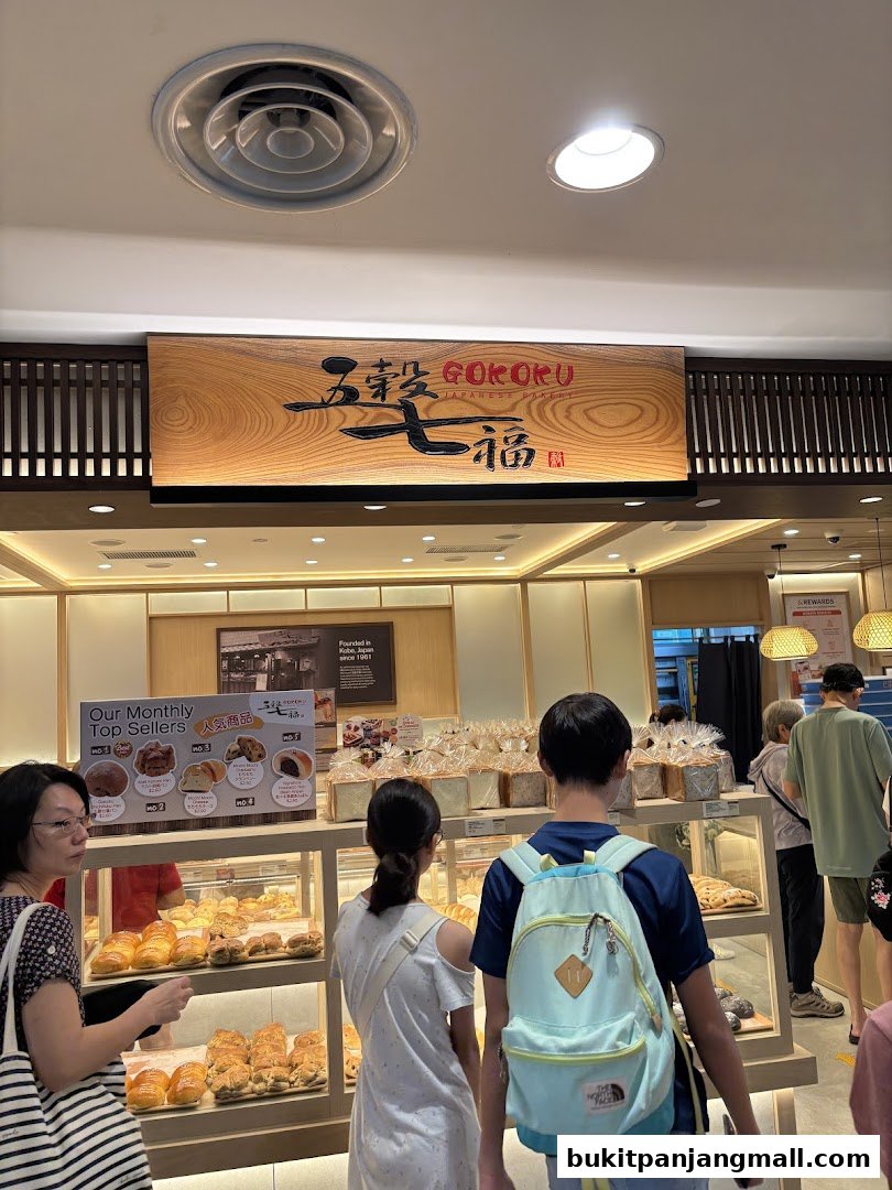 Customers browse a selection of fresh bread and pastries at Gokoku Japanese Bakery.