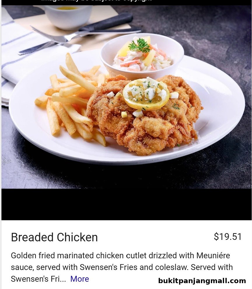 A plate of golden fried breaded chicken with fries and coleslaw.
