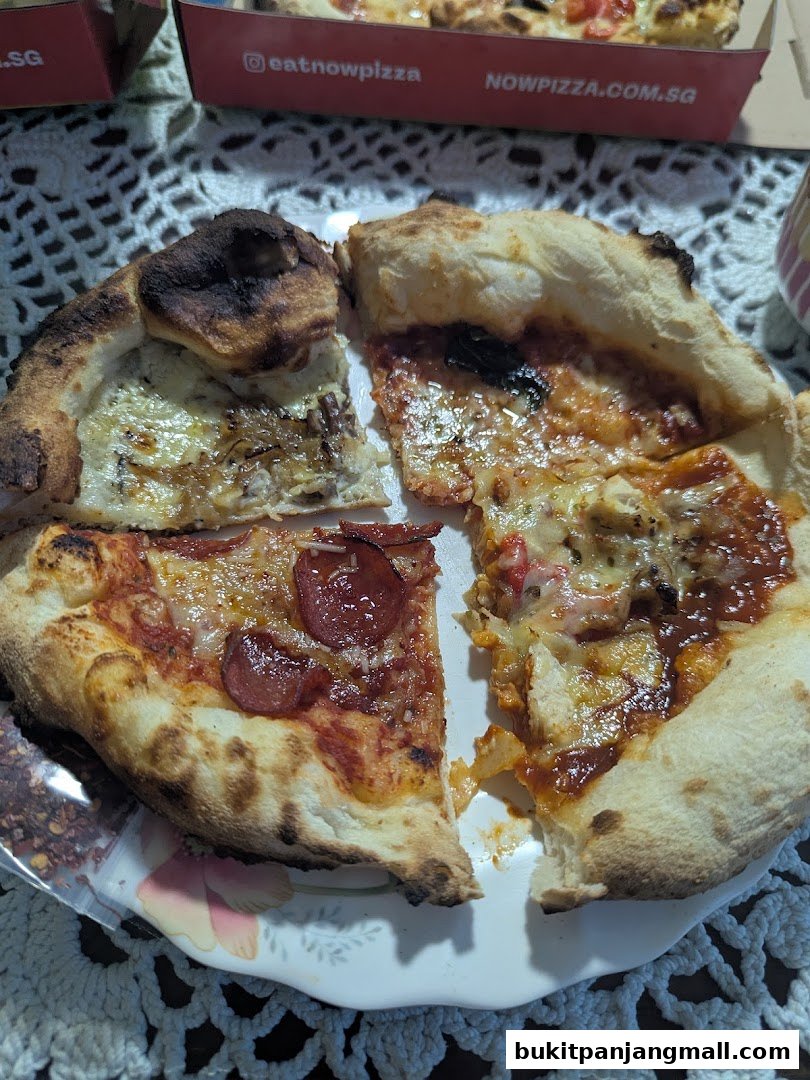 A plate of delicious pizzas with various toppings, served in pizza boxes.