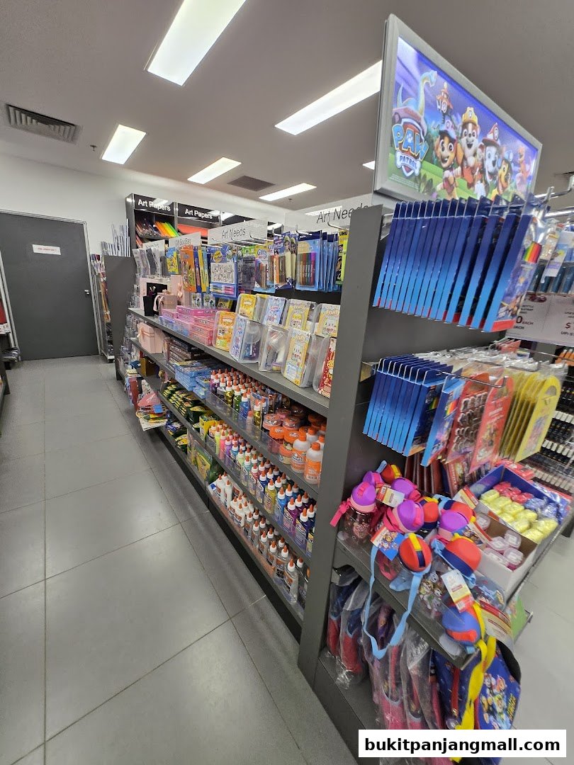 A well-stocked aisle in a POPULAR Bookstore, featuring art supplies and children's merchandise.