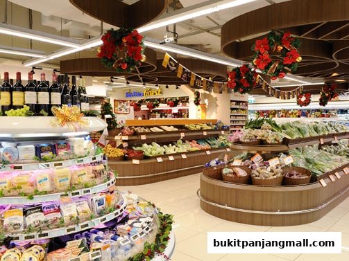 Interior view of a FairPrice Finest supermarket with fresh produce and wine displays.