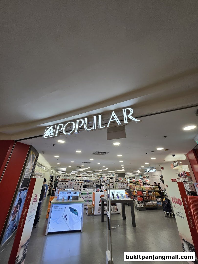 The entrance of POPULAR Bookstore, showcasing a wide selection of books and electronics.