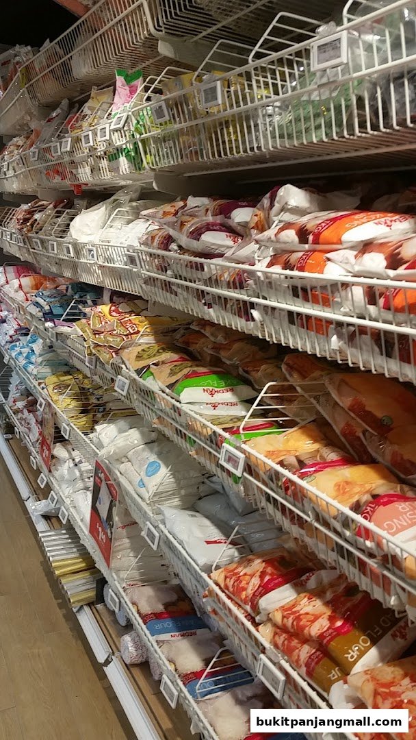 Shelves stocked with various baking ingredients and supplies at RedMan by Phoon Huat.