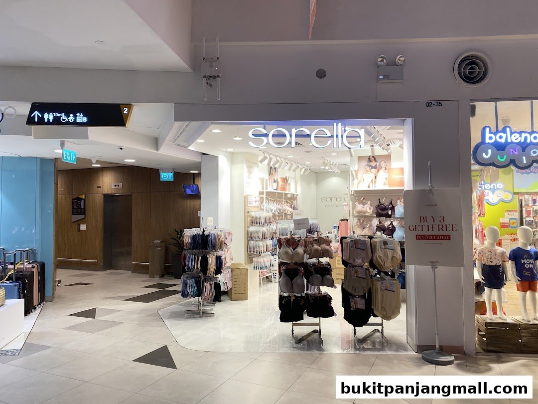 The entrance of a Sorella lingerie shop with displays of bras and underwear, and a promotional sign.