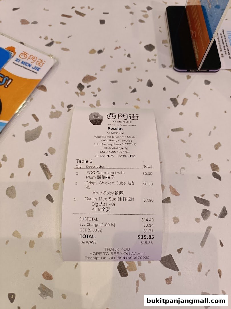 A receipt from Xi Men Jie, a Taiwanese restaurant, detailing food items and total cost.