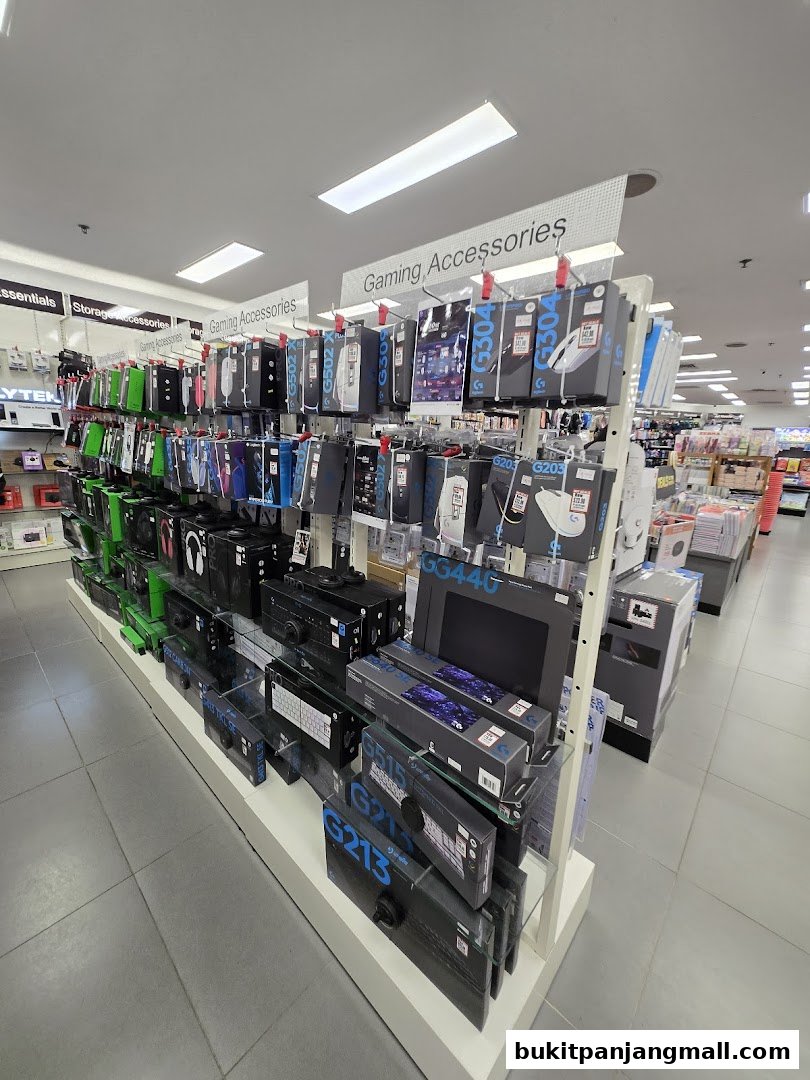 A display of gaming accessories including mice, keyboards, and headsets in a retail store.