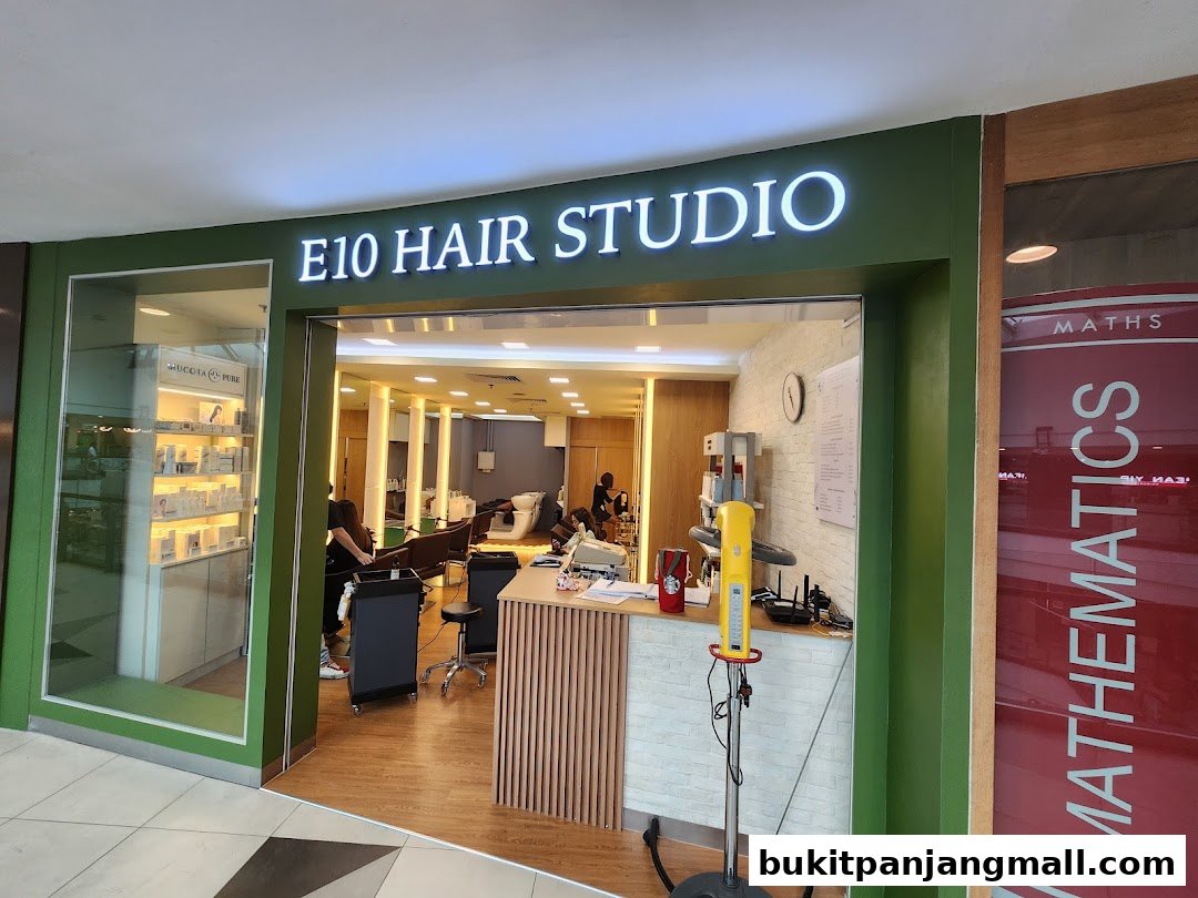 The entrance to E10 Hair Studio, showcasing a clean interior with styling stations and product displays.