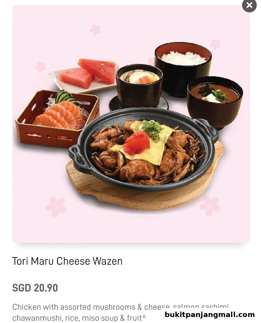 A delicious Japanese meal featuring chicken with cheese, salmon sashimi, and side dishes.
