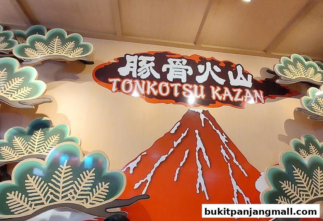 The sign for Tonkotsu Kazan restaurant features Japanese characters and a stylized Mount Fuji.