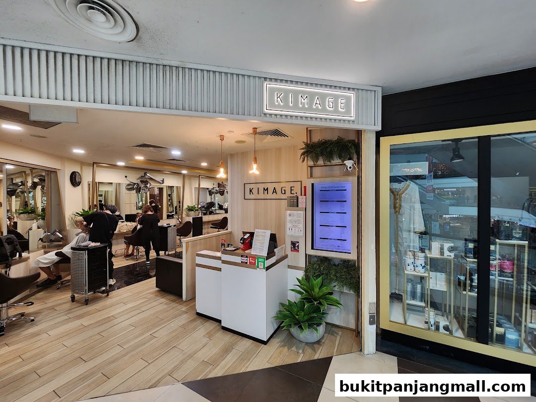 Interior view of Kimage Hair Salon with stylists attending to clients and a digital service menu.