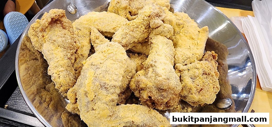 A close-up shot of a large serving of crispy, golden-brown fried chicken.