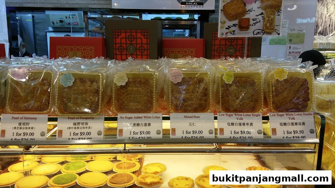 A display of individually packaged mooncakes and tarts at FairPrice Finest.