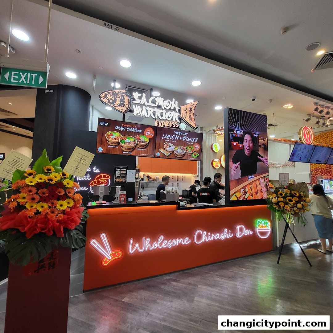 Salmon Warrior Express shop front with a vibrant orange counter and menu displays.