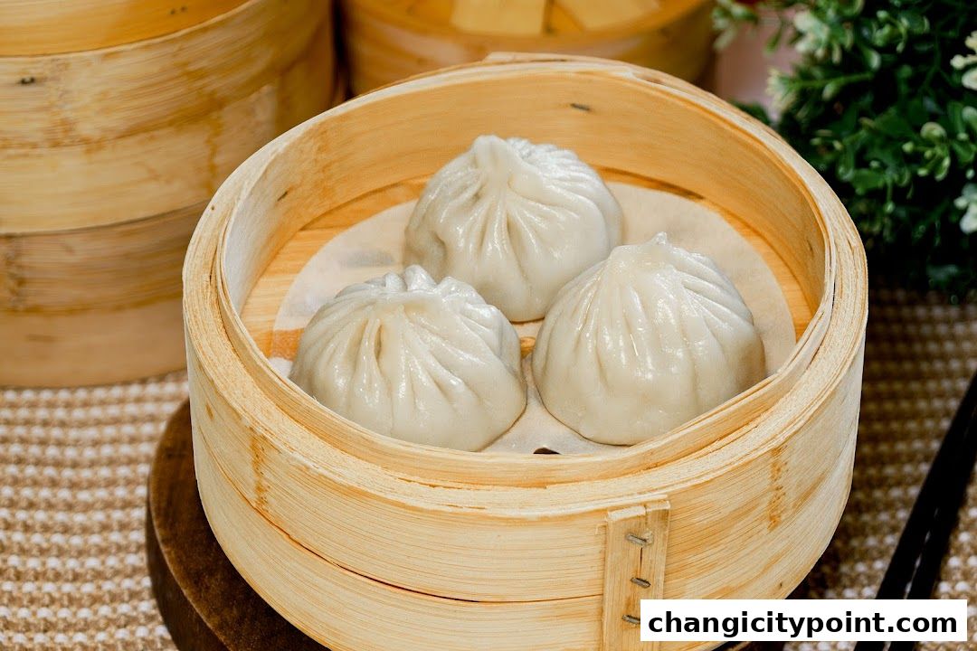 Three steaming dim sum dumplings served in a bamboo steamer basket.