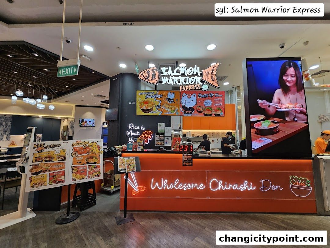 Salmon Warrior Express shop front with menu boards and a digital display.