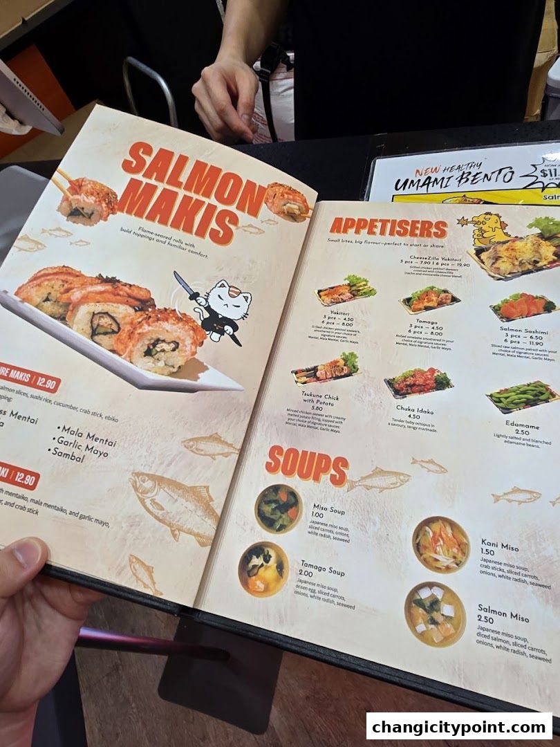 A menu open to a page featuring Salmon Makis, Appetisers, and Soups with enticing images.