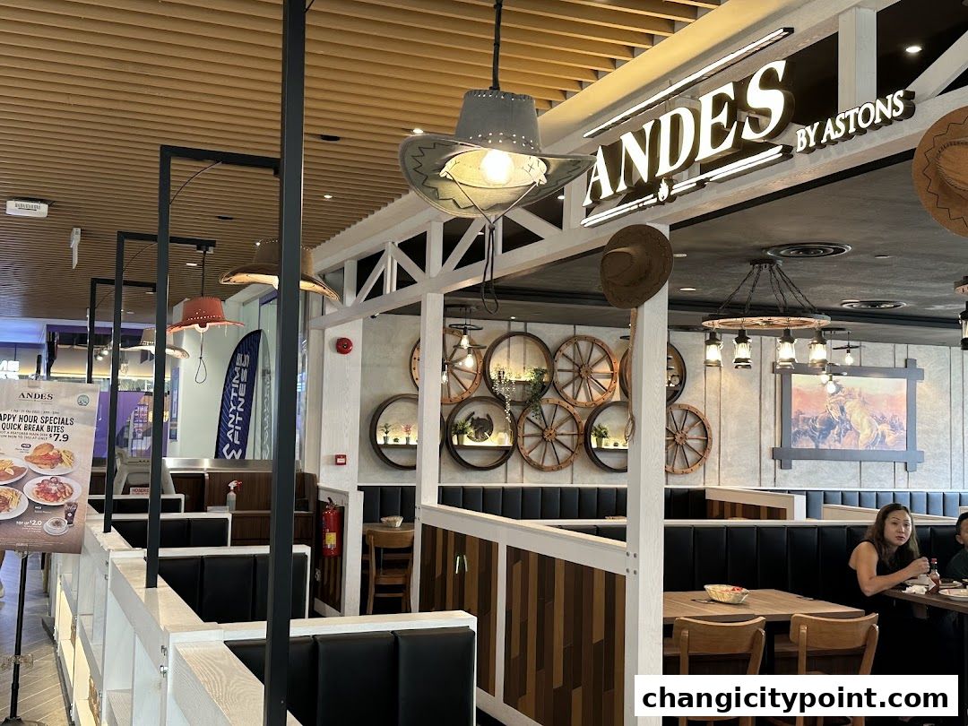 Interior of ANDES by ASTONS restaurant with cowboy-themed decor and seating.