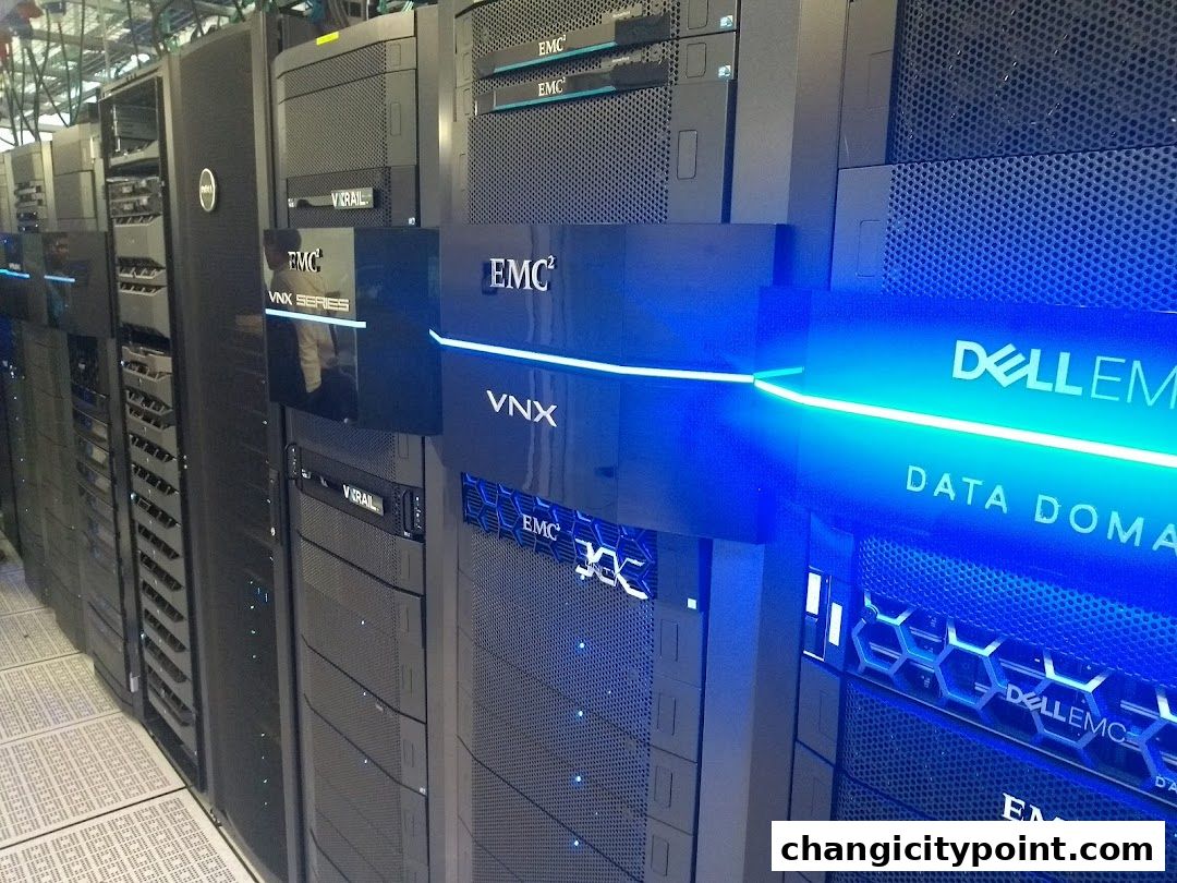 Rows of Dell EMC data storage servers with blue LED lighting.