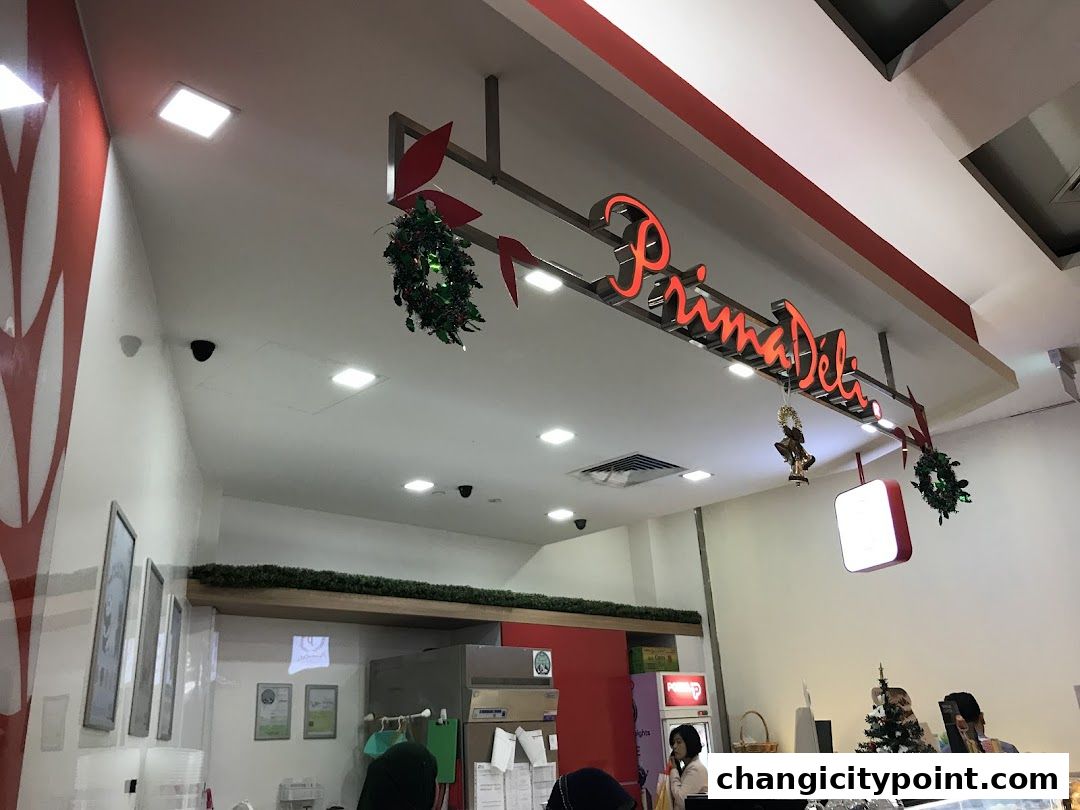 Interior view of PrimaDéli with festive decorations and staff.