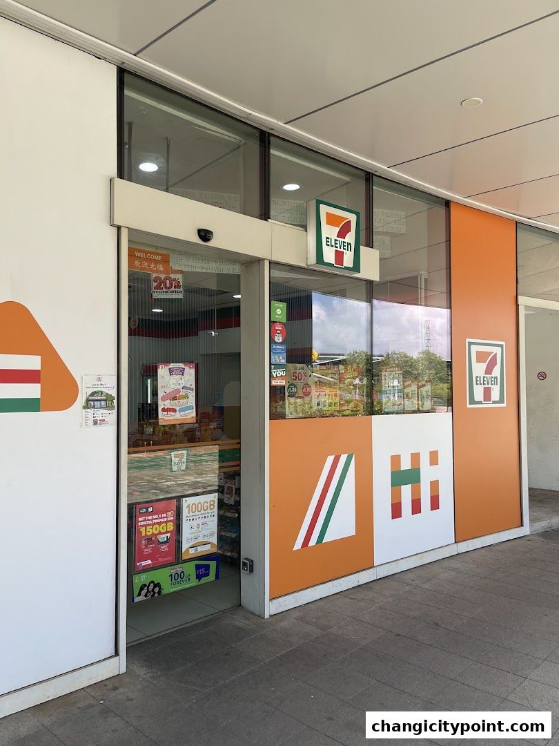 The exterior of a 7-Eleven convenience store with its iconic branding and entrance.