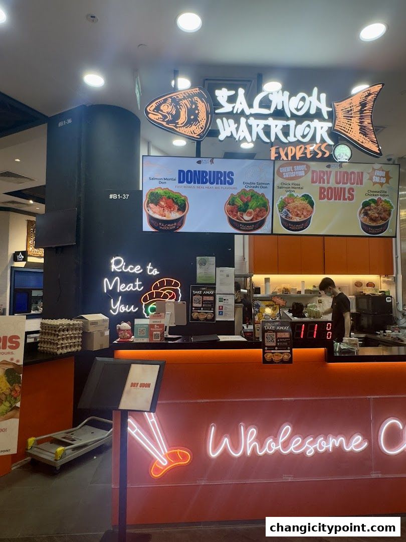 Salmon Warrior Express shop front with menu displays and neon signage.