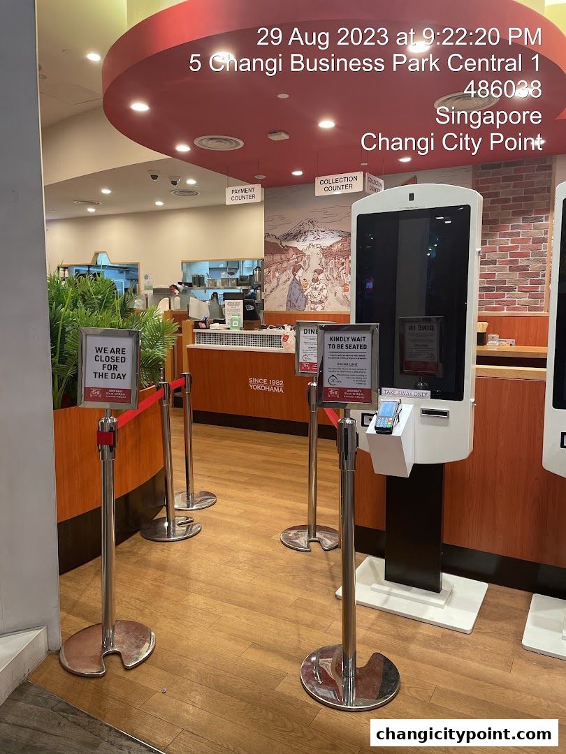Entrance to Sukiya Gyudon Curry Changi City Point, showing queue barriers and a 'closed' sign.