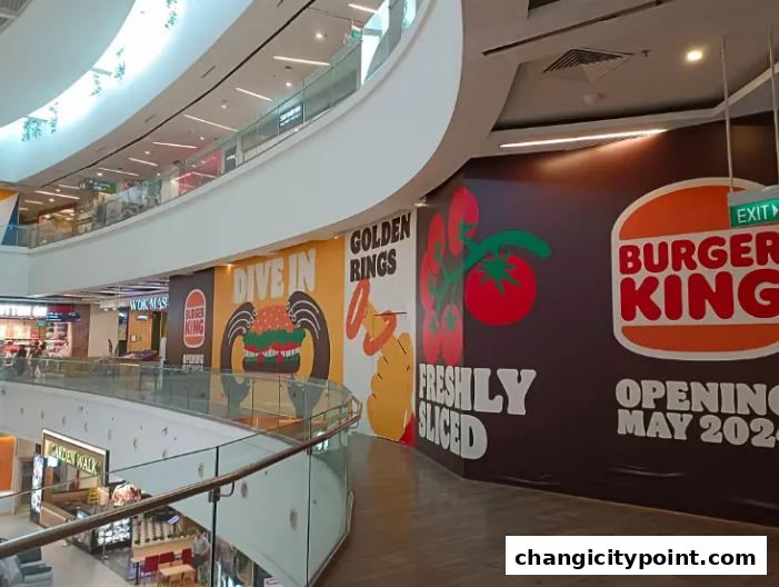 Burger King storefront under construction with promotional graphics and opening date.