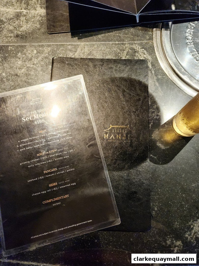 A menu from Hanjip Korean Grill House showing set dinner options and prices.