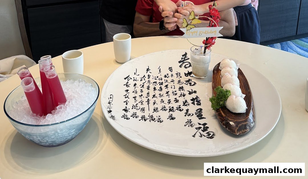 A festive table setting with drinks and a celebratory dish, possibly for a birthday.