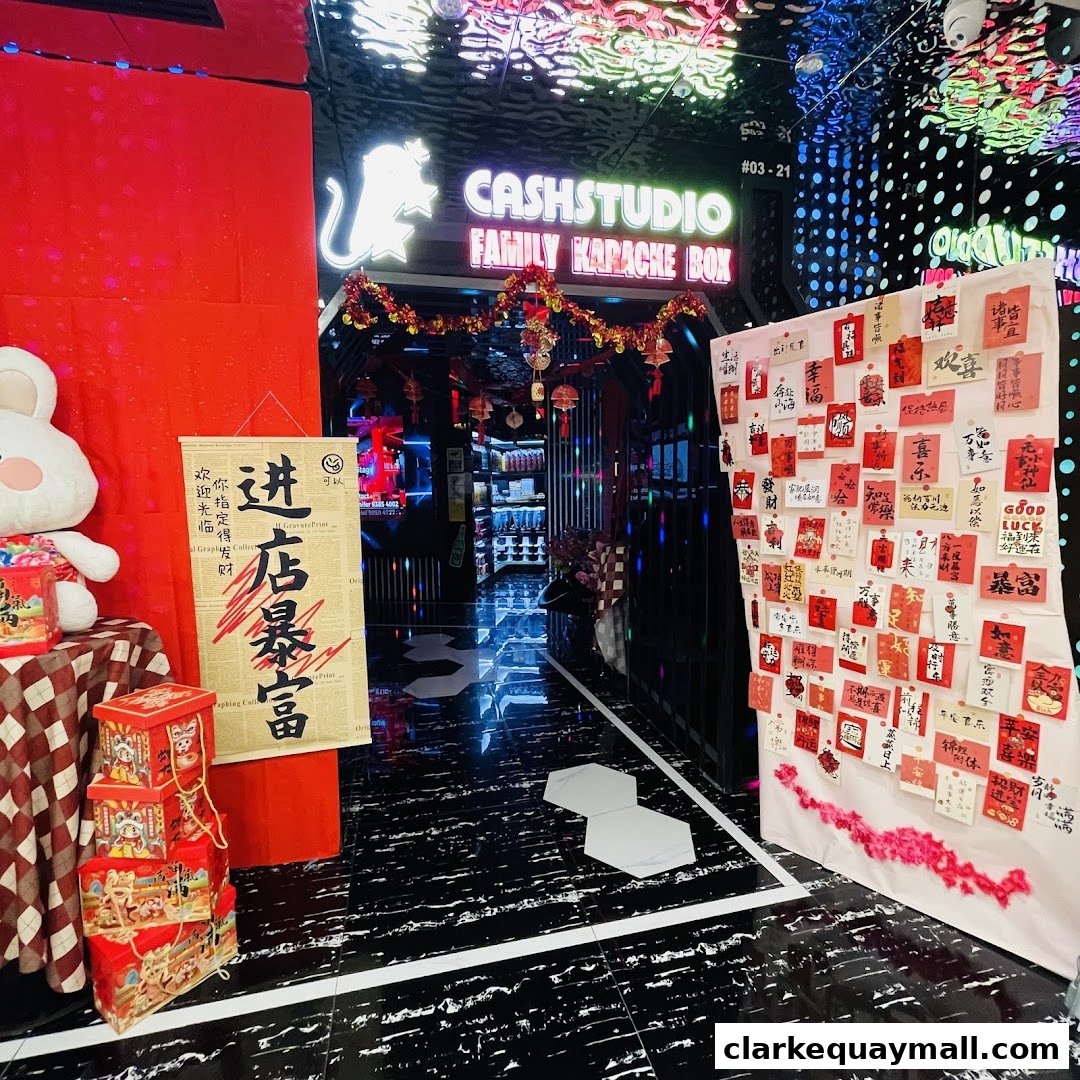 The entrance to Cash Studio Family Karaoke Box decorated with festive red and gold Chinese New Year decorations.