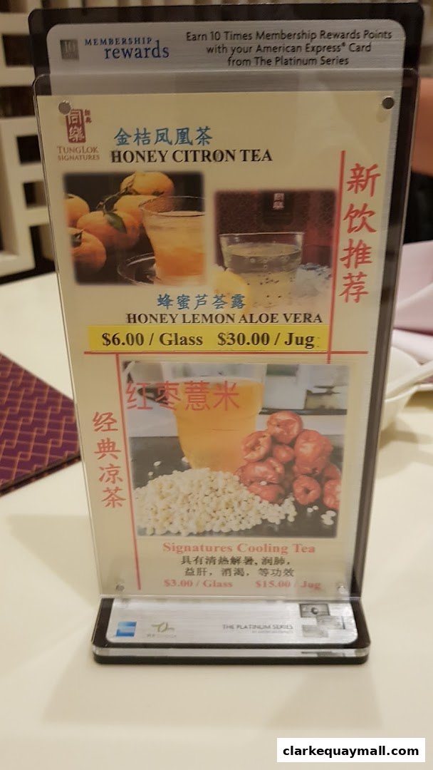 A menu display for TungLok Signatures featuring Honey Citron Tea and Cooling Tea.