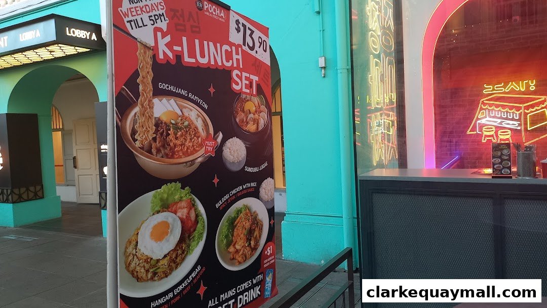 A promotional sign for POCHA Korean Street Dining's K-Lunch Set, featuring various Korean dishes.