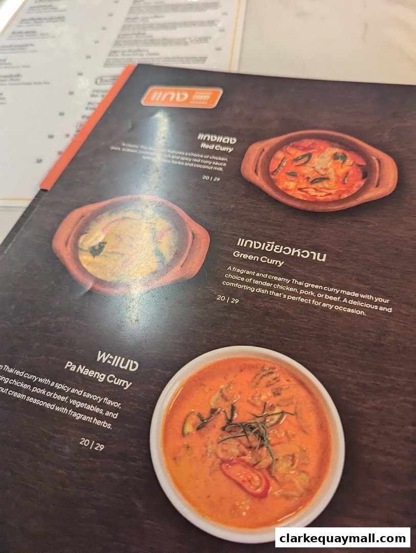 A menu from Nana Thai Royale Clarke Quay featuring Thai curries with descriptions and prices.
