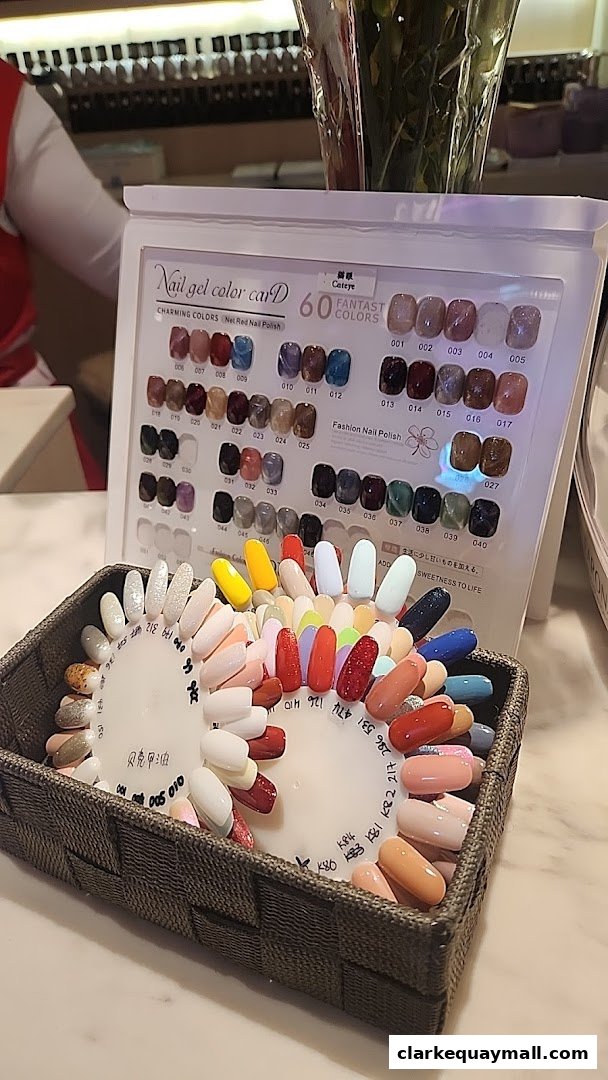 A display of nail polish color swatches and a color chart with various shades.