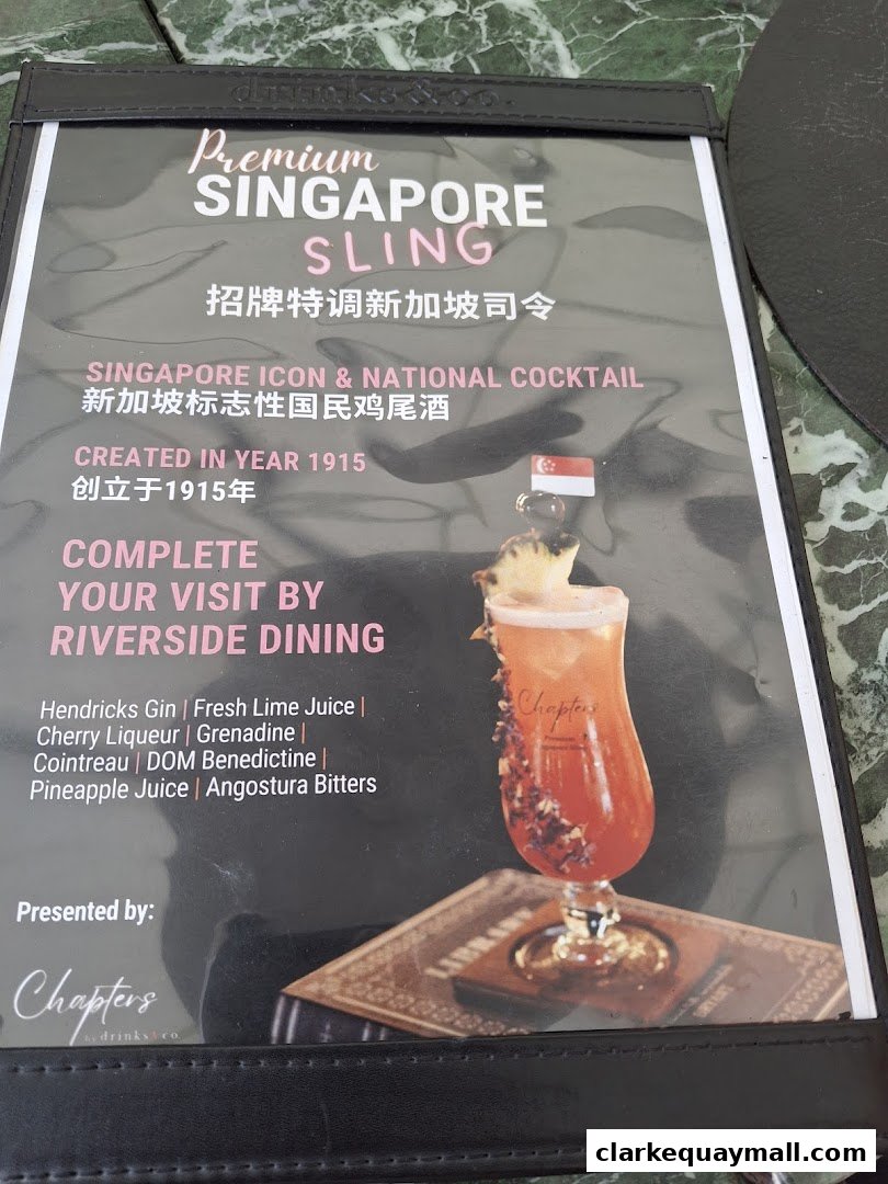 A menu featuring the Premium Singapore Sling cocktail with its ingredients and history.