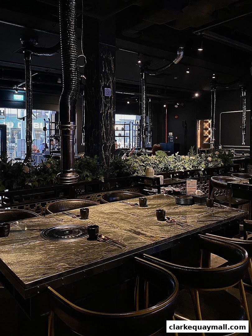 Interior of Hanjip Korean Grill House with a table set for dining.