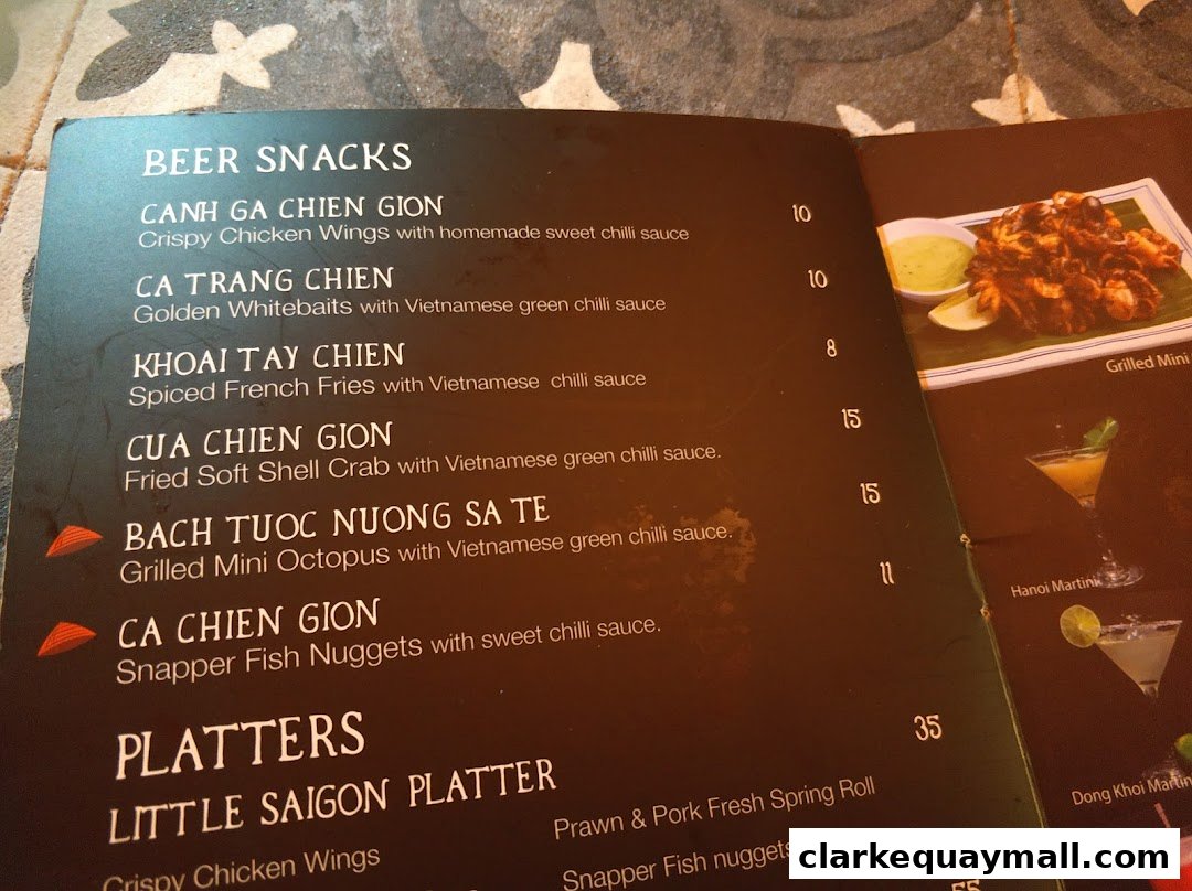 A menu from Little Saigon featuring beer snacks and platters with prices.