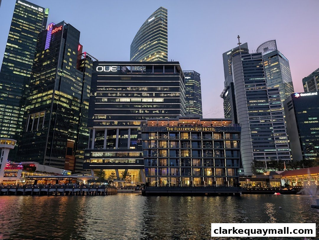 Skyline view of Singapore's financial district with The Fullerton Bay Hotel prominently featured.