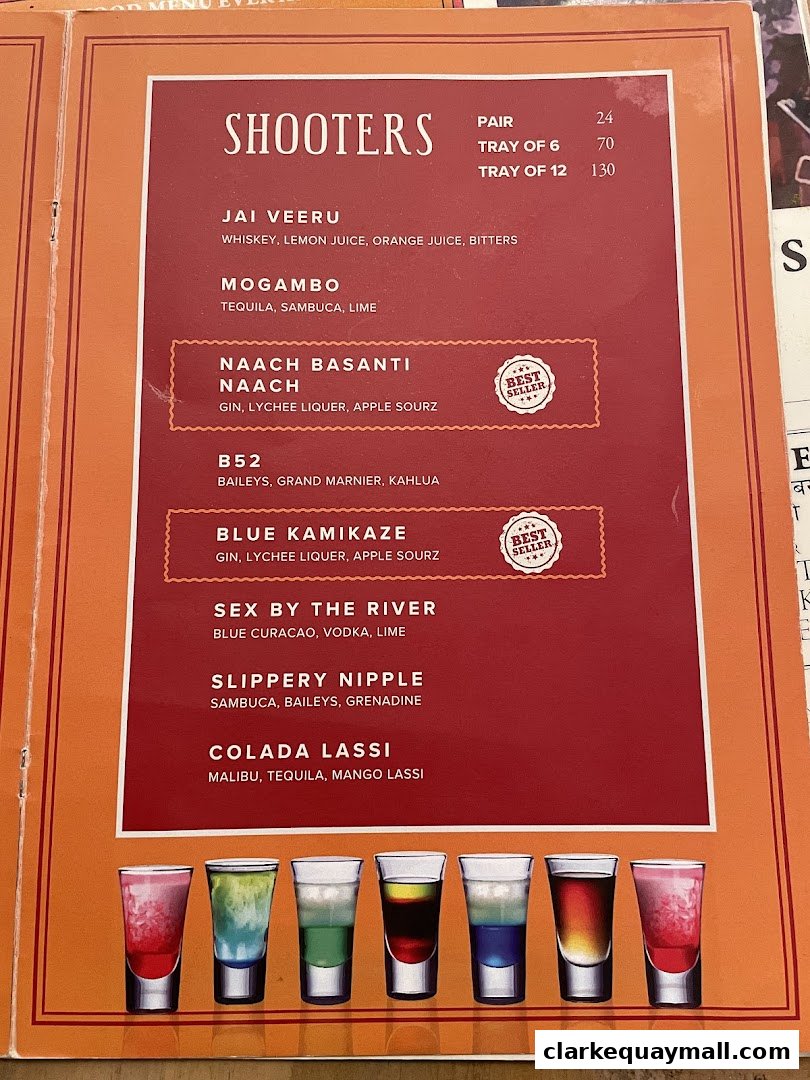 A menu featuring various colorful shooters with their ingredients and prices.