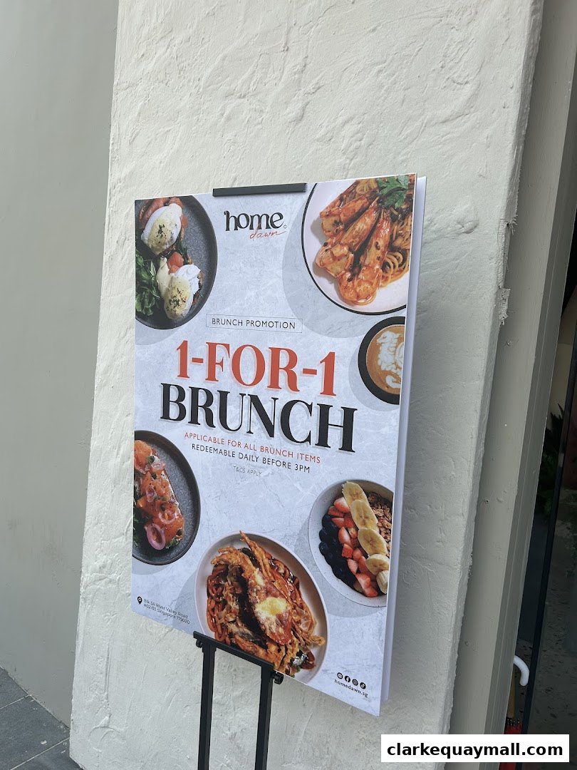 A promotional sign for a 1-for-1 brunch offer at Home Dawn, featuring images of various brunch dishes.