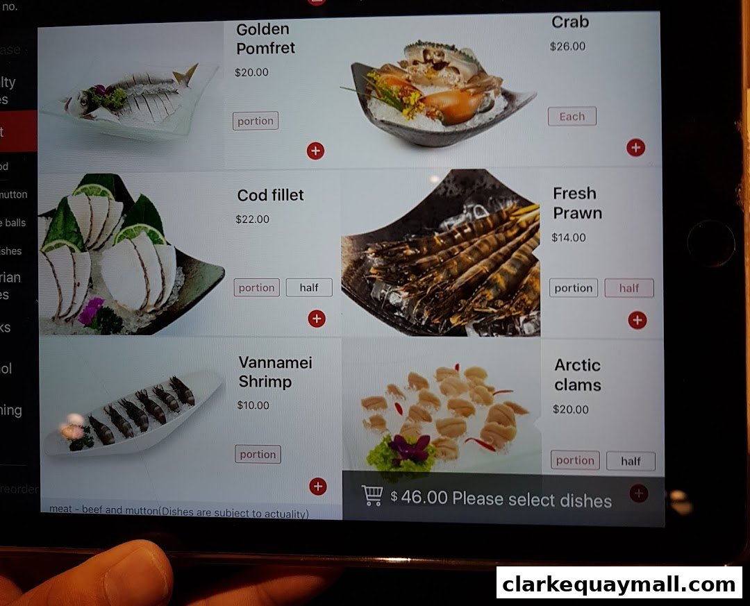 A tablet screen displaying a menu of seafood dishes for hot pot.