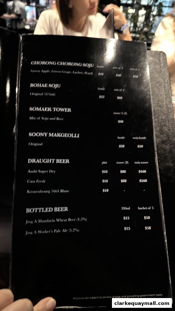 A menu from Hanjip Korean Grill House featuring various Korean drinks and beers.