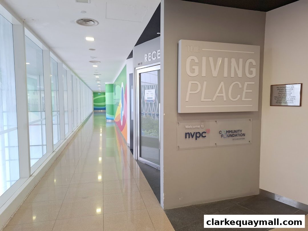 The entrance to The Giving Place, a community foundation, with signage and a hallway.