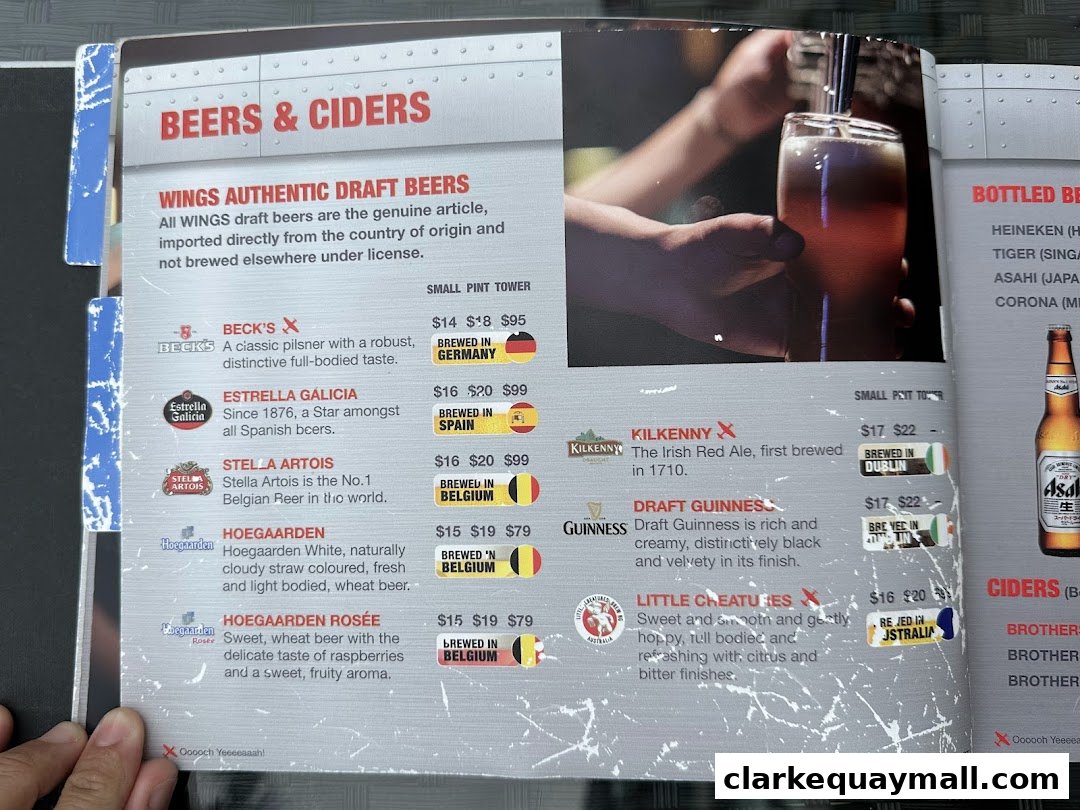 A menu page from Wings Bar & Grill featuring a selection of beers and ciders with prices.