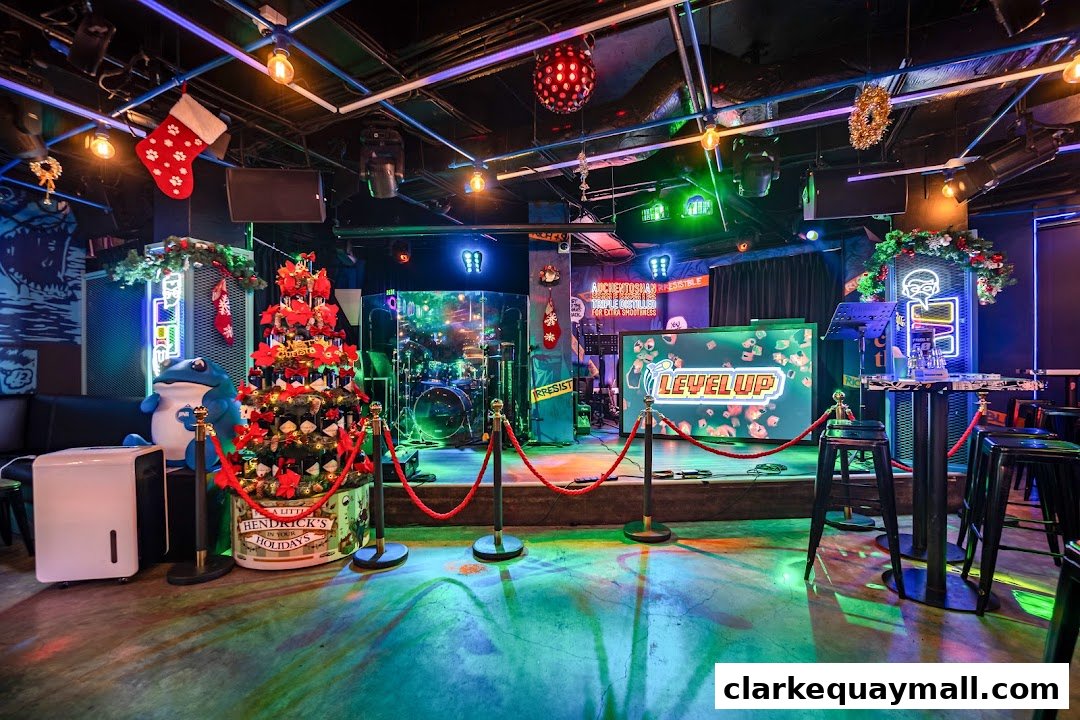 Interior of Level Up bar with a stage, Christmas decorations, and seating.