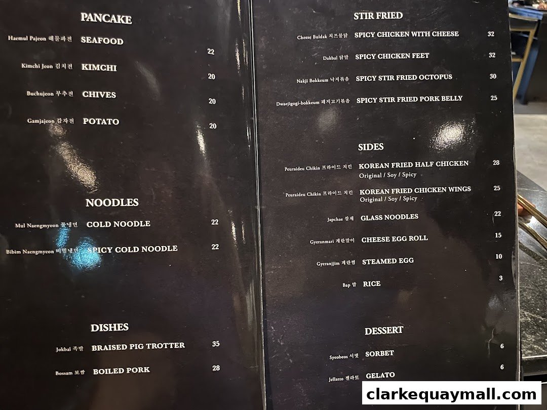 A menu from Hanjip Korean Grill House featuring Korean dishes like pancakes, noodles, stir-fries, and desserts.