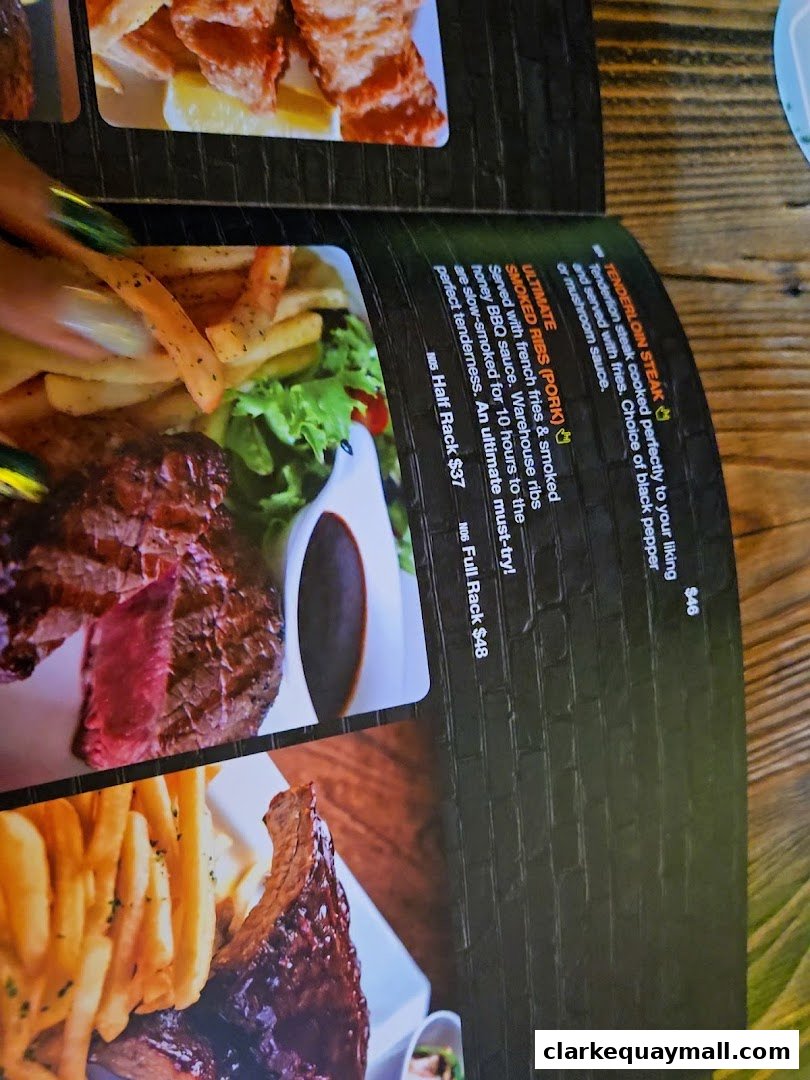 A menu page from Warehouse Bar featuring steak and ribs with fries.