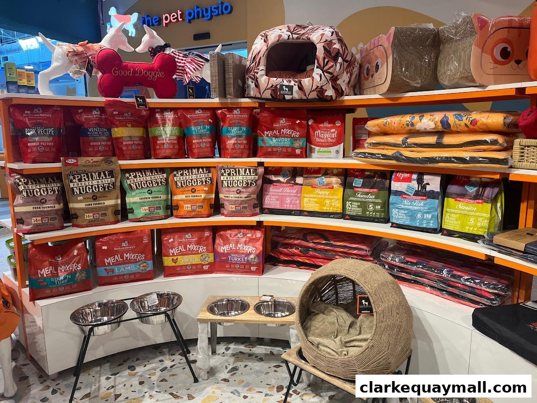 A well-stocked pet store shelf featuring various brands of dog food and accessories.
