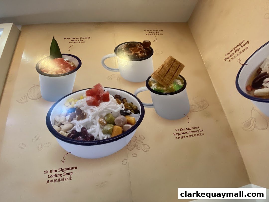 A menu display featuring various dessert bowls and drinks from Ya Kun Kaya Toast.